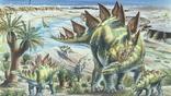 A group of stegosaurus dinosaurs with young